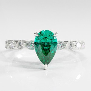 Pear Cut Lab Grown Emerald Hidden Halo Side Stone Engagement Ring