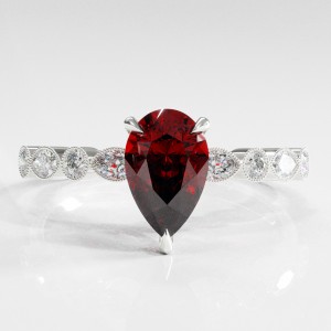 Pear Cut Lab Grown Ruby Hidden Halo Side Stone Engagement Ring