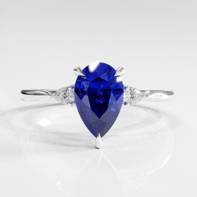 Pear Cut Lab Grown Sapphire Three Stone Engagement Ring